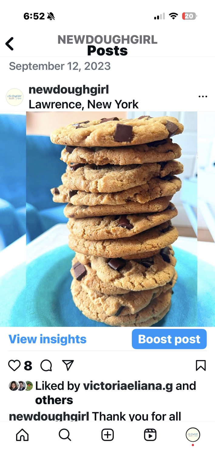 A tall stack of New Dough Girl chocolate chunk cookies